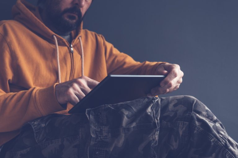 Casual man using digital tablet computer